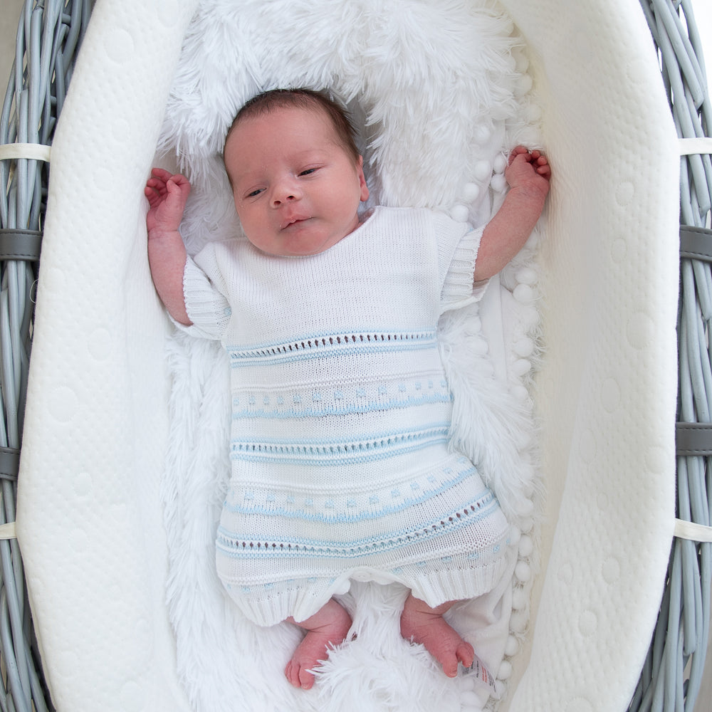 Baby in blue & white knitted pointelle romper