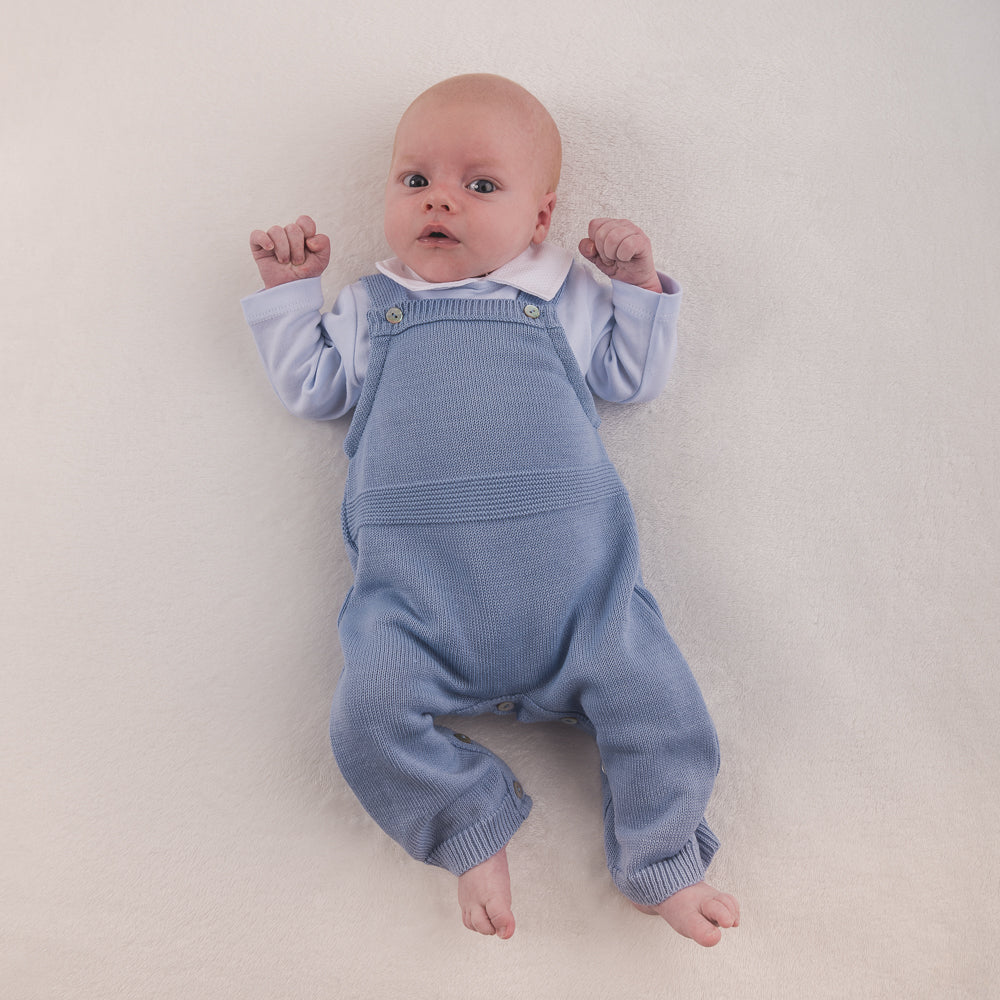 Baby with arms up on white background wearing Dusty Blue Knitted Romper