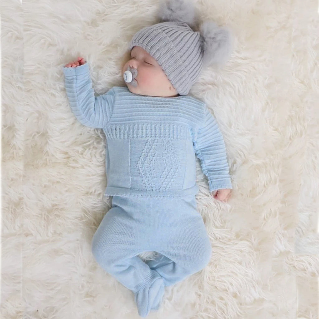 Baby wearing the blue diamond knitted set