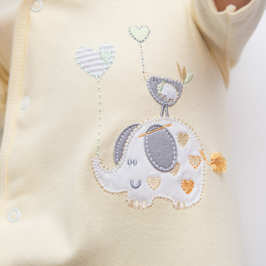 Detail on the 'Elephant & Bird' lemon cotton sleepsuit