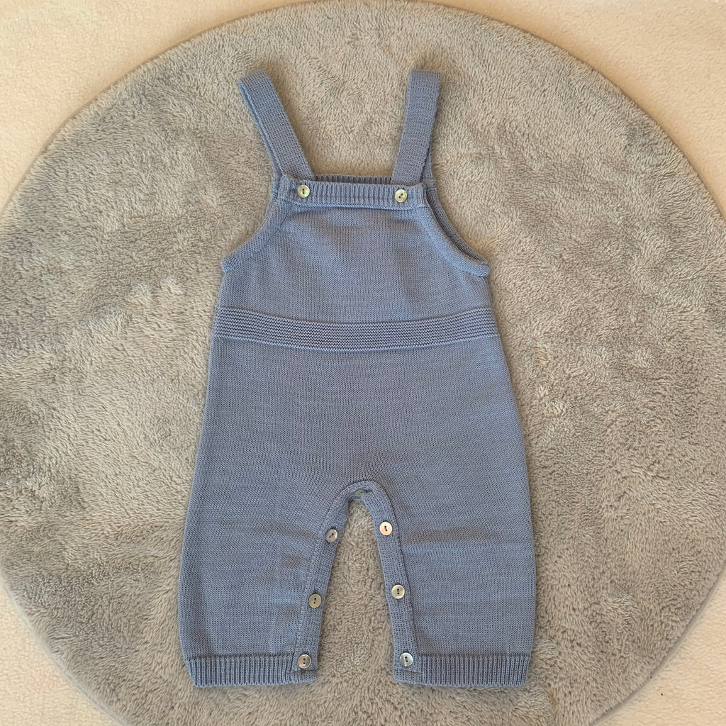 Dusty Blue Knitted Romper on a grey circle rug