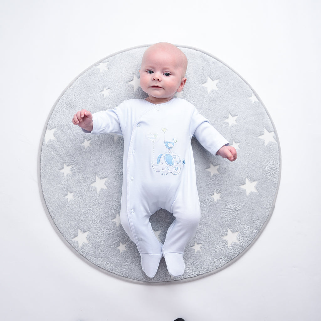 Baby wearing 'Elephant & Bird' blue cotton sleepsuit